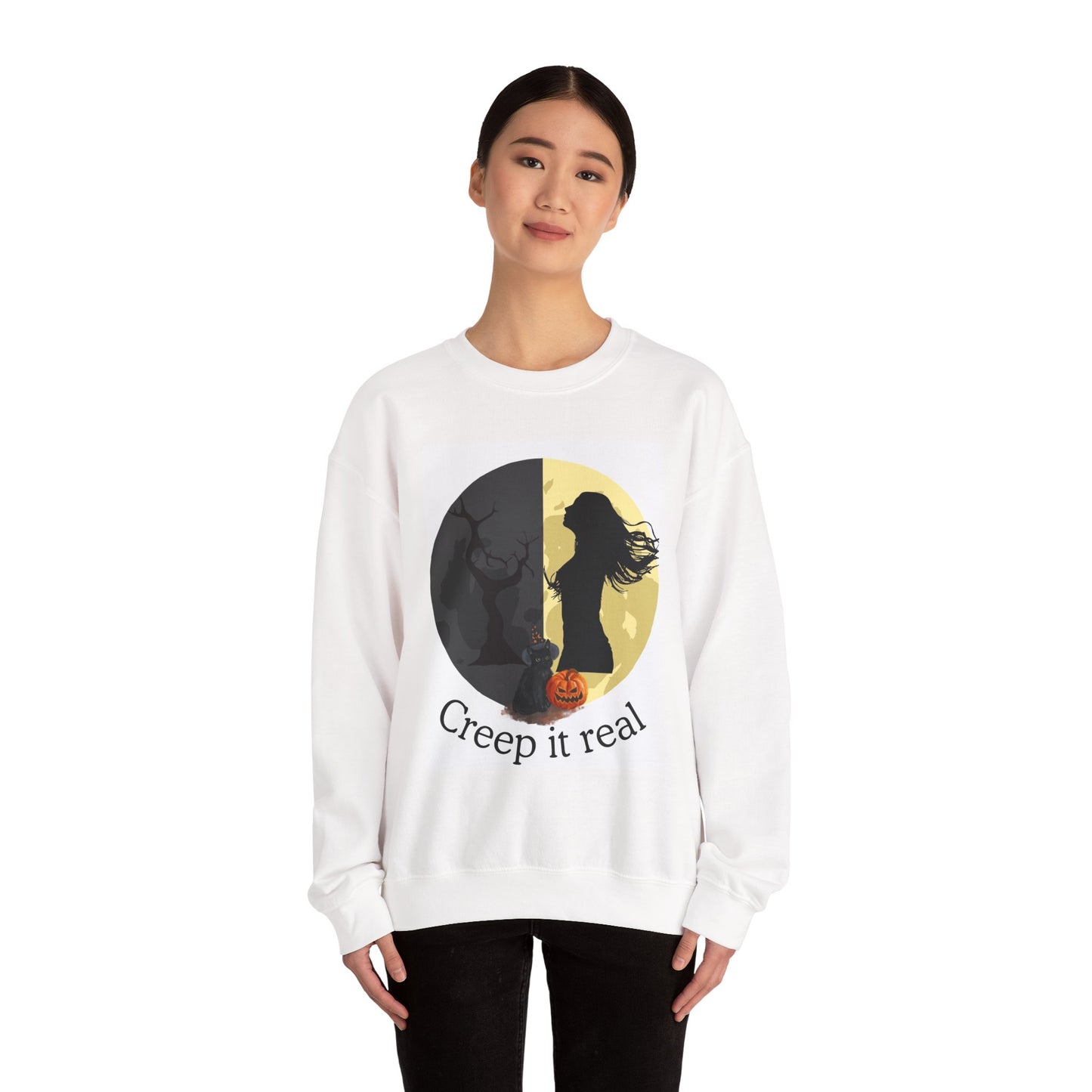 Person wearing a white sweatshirt with a Halloween-themed design and text.