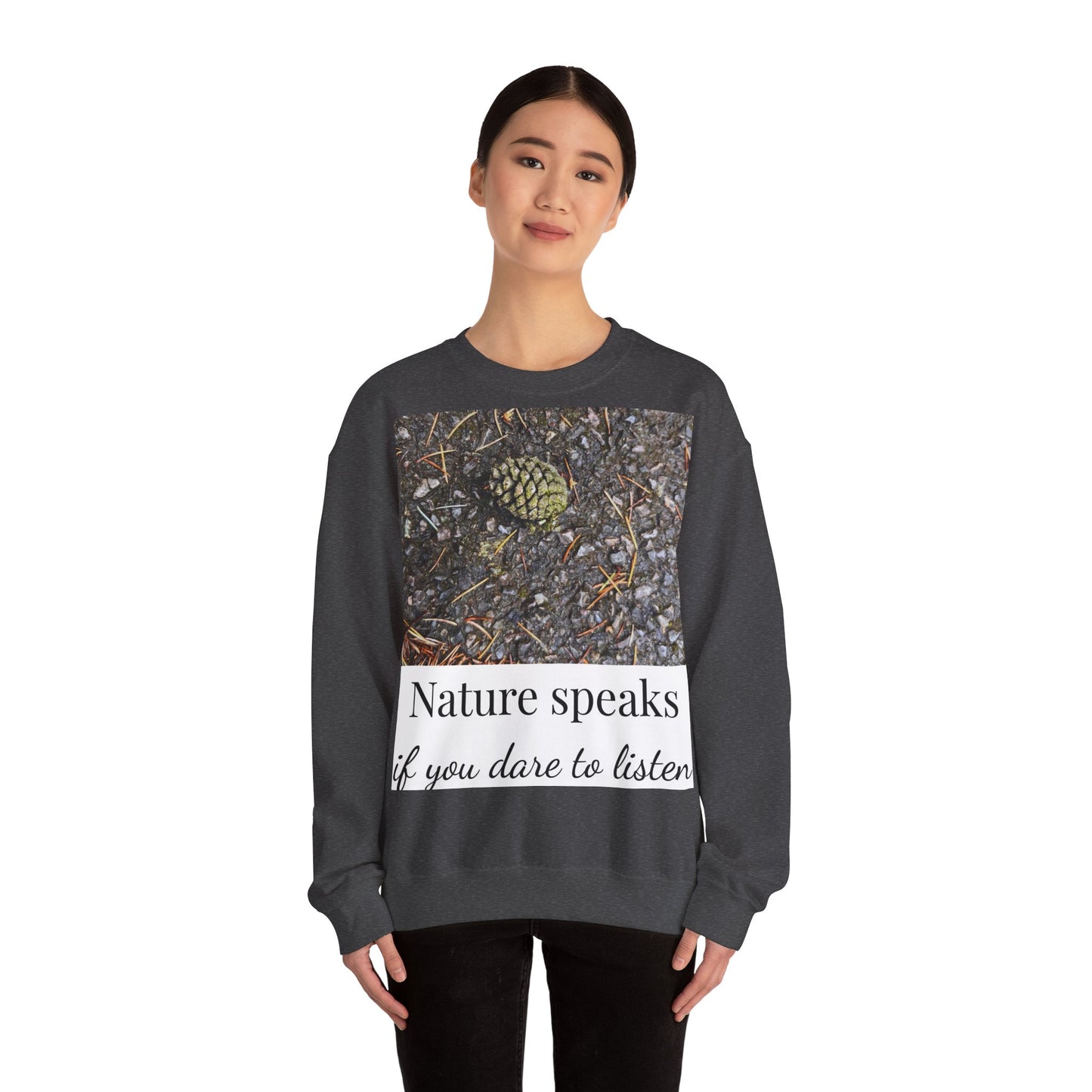 Person wearing a dark gray sweatshirt with nature-themed design and text on a white background