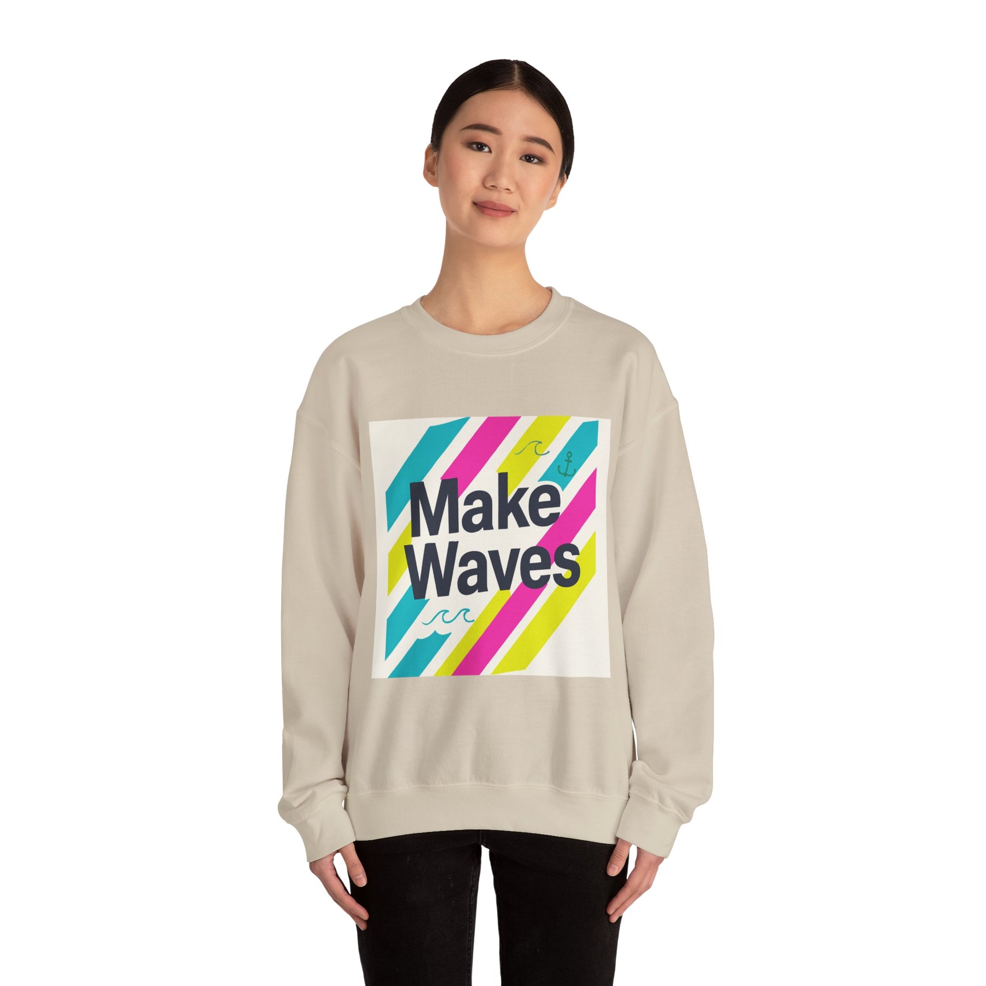 Person wearing a beige sweatshirt with 'Make Waves' design on a white background
