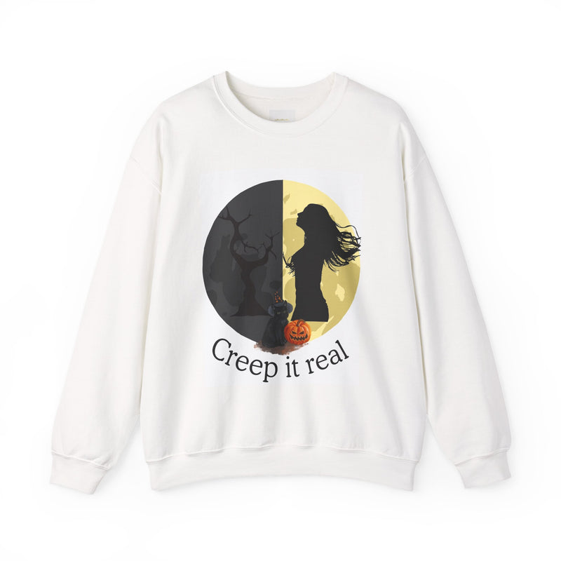 White sweatshirt with Halloween-themed design featuring a silhouette of a woman, cat, and pumpkin with 'Creep it real' text.