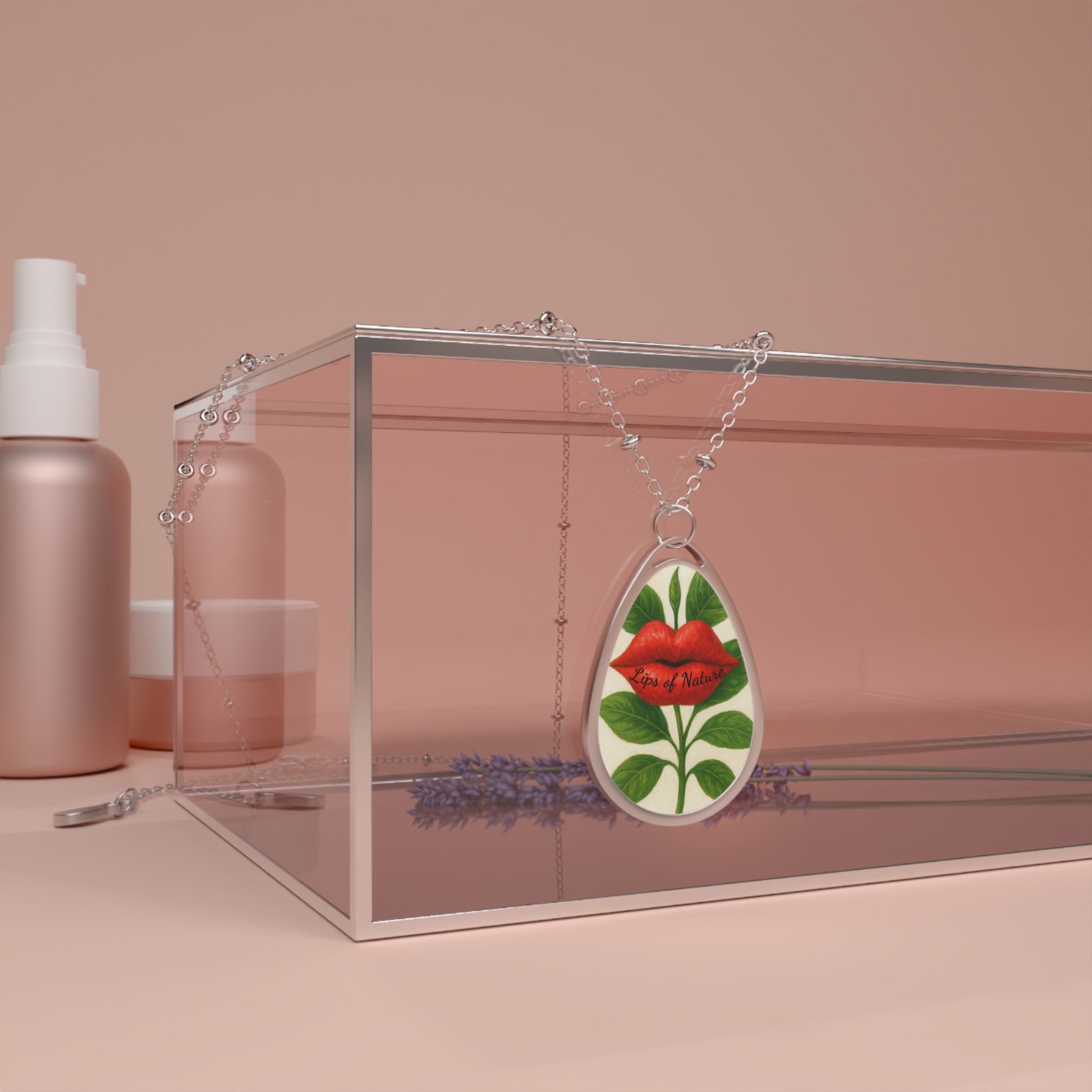 Teardrop-shaped pendant with floral design on a pink background