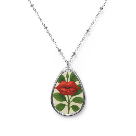 Teardrop-shaped pendant with floral design and red lips on a white background