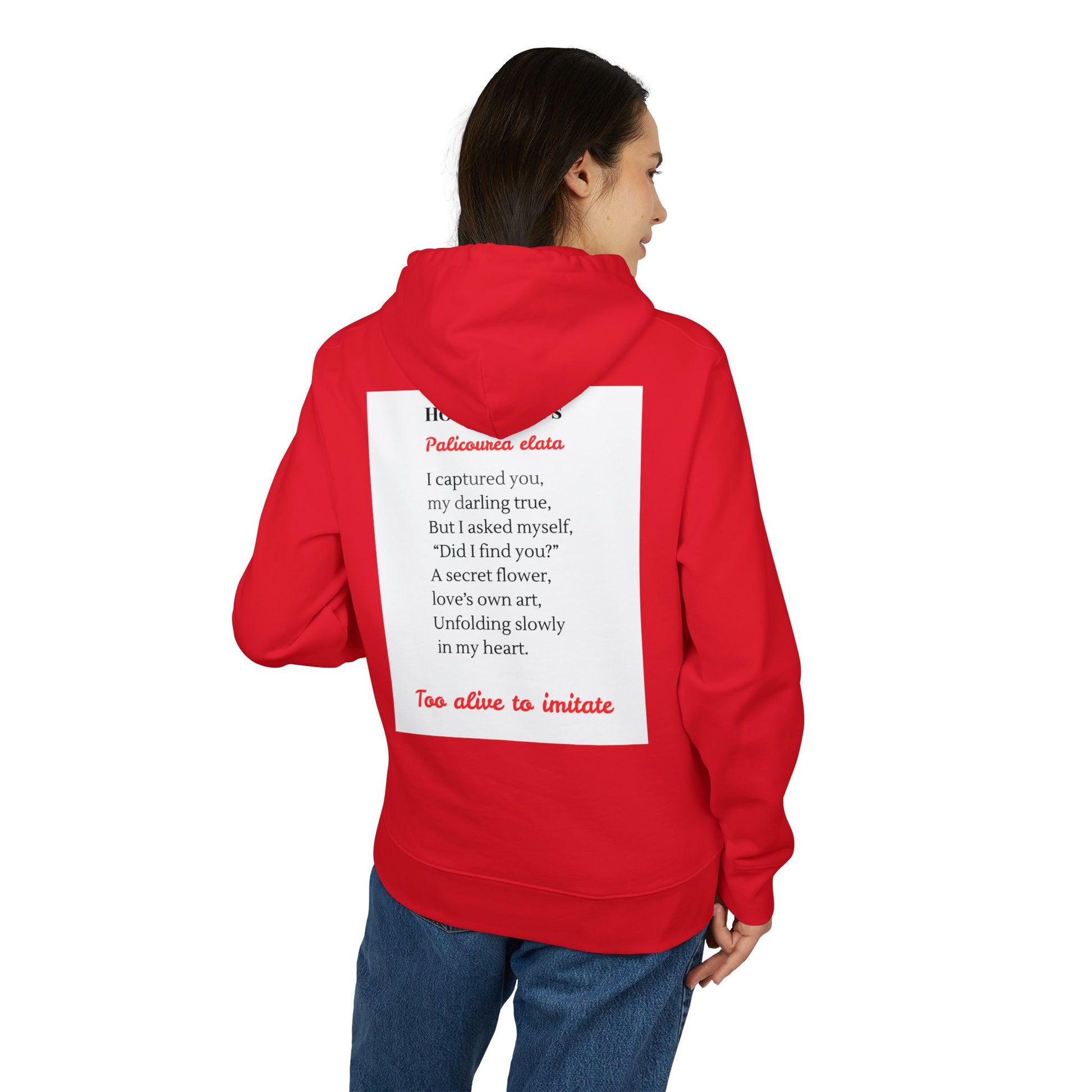 Person wearing a red hoodie with text on the back, standing against a white background