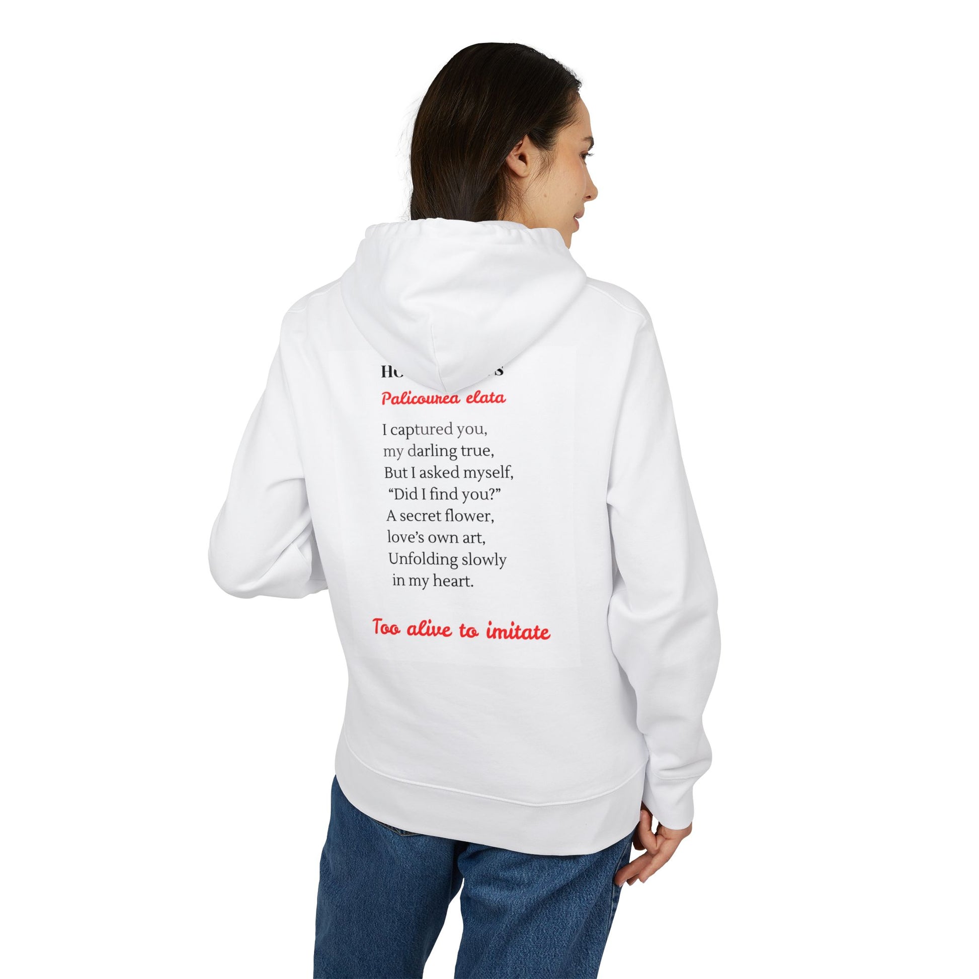 Person wearing a white hoodie with text on the back, standing against a white background